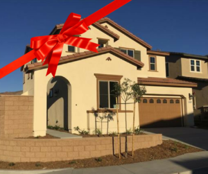 Front view of a new construction home with a bow on it